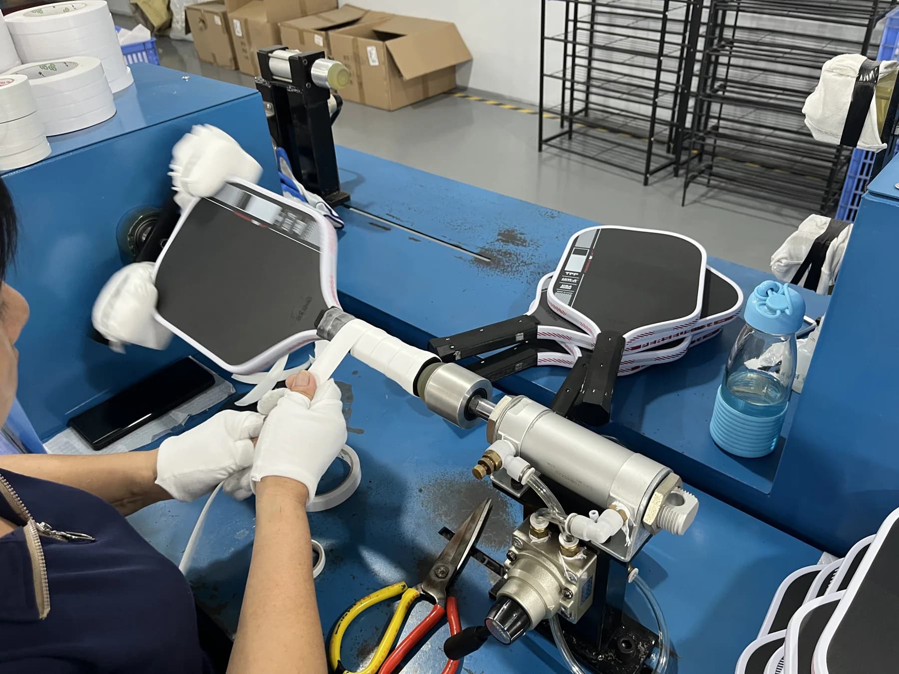 Paddle grip wrapping workstation in the SHUEN factory